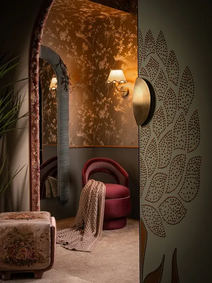 This corner perfectly captures our love for layering textures and moods. The perforated door detail, the rich velvet chair, the floral ottoman, and the delicate wallpaper all come together to create a space that feels curated and full of stories.
