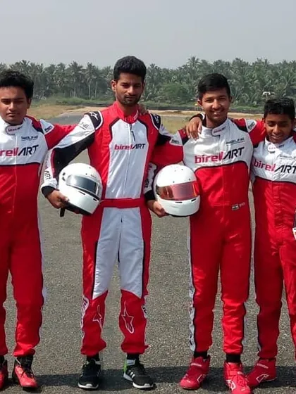 Our drivers posing together on the track, representing the next generation of Indian racing talent.
