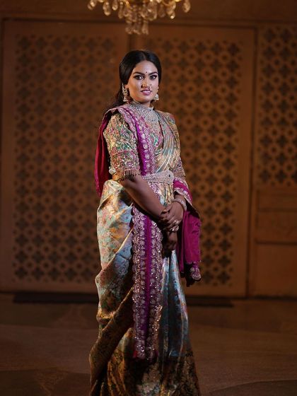 A truly royal look for this special bride. She is wearing a unique designer blouse and a beautiful saree, and we complemented it with makeup that is both regal and elegant.