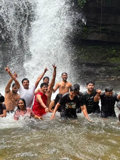 The energy of the group is infectious as they enjoy the powerful spray of the waterfall. This is a perfect example of the fun we have on my trips.
