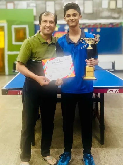 We guide players to the pinnacle of success. This is one of our champions with his well-deserved trophy, a testament to the hard work and advanced strategy we instill in our competitive program.