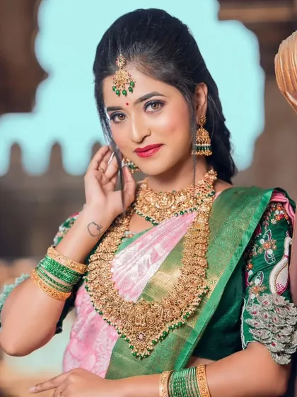 A close-up shot highlighting the intricate details of the choker and jhumkas, featuring fine carvings and stone inlays.