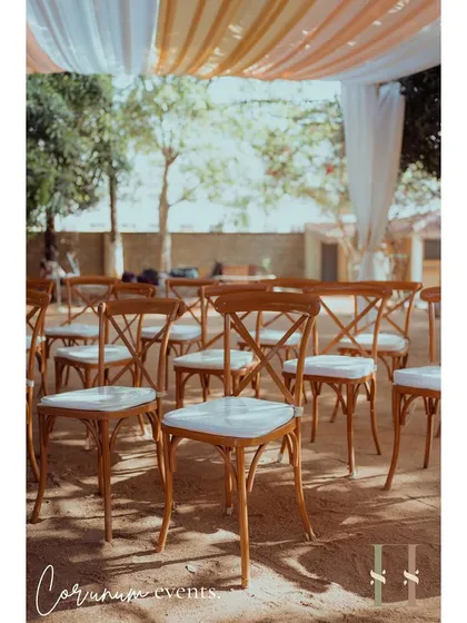 The ceremony seating arranged under the shade of mango trees, creating a natural and beautiful setting for this intimate wedding.