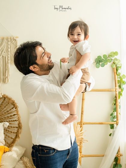 A father lifts his son high, and the joy on both their faces is unmistakable. These are the moments of pure happiness I strive to capture.