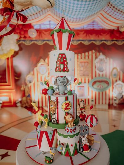 This magnificent four-tiered cake was the centerpiece of the 'Le Cirque Magnifique' party. Adorned with intricate fondant animals, a circus tent topper, and the birthday boy's initial, it was a delicious work of art that perfectly matched the theme.