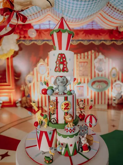This magnificent four-tiered cake was the centerpiece of the 'Le Cirque Magnifique' party. Adorned with intricate fondant animals, a circus tent topper, and the birthday boy's initial, it was a delicious work of art that perfectly matched the theme.