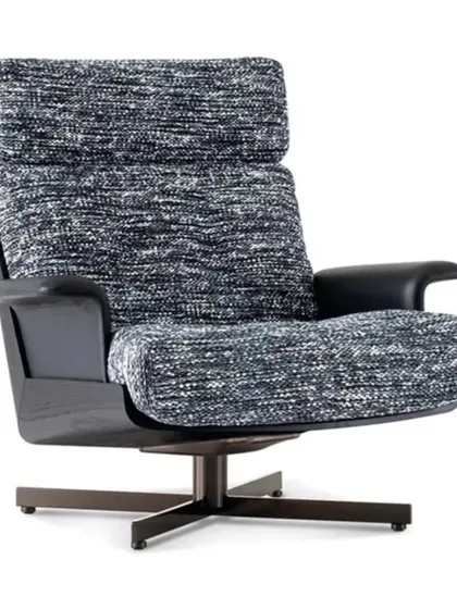 This is a variant of our swivel lounge chair, upholstered in a durable, textured black and white fabric. The dark wood accents on the arms and base add a touch of classic elegance.