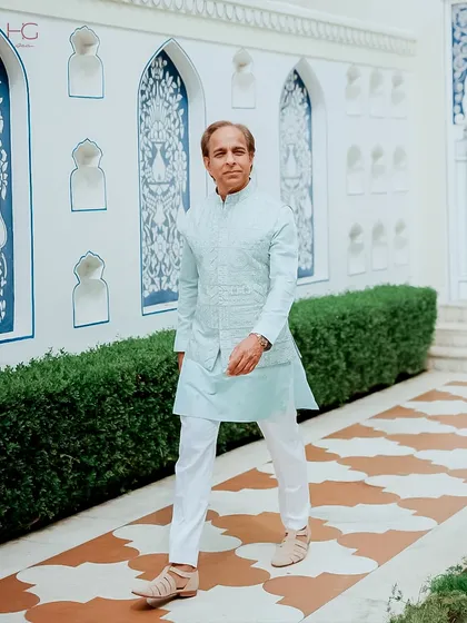 The full look of the pastel blue bundi set, showing its clean lines and comfortable fit, perfect for a long day of wedding festivities.