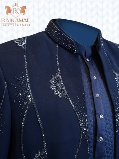 A detailed shot of the sparkling beadwork on the collar and lapel of the navy blue open Indo-Western jacket.