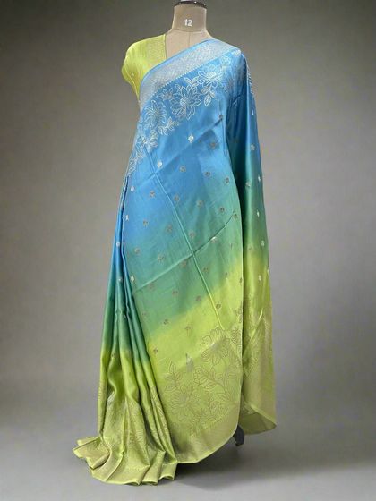 A fresh shaded satin saree that transitions from blue to neon green.