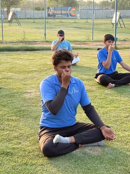 A calm mind is a powerful weapon. Our athletes, including our para-archers, practice pranayama breathing exercises on the field. This is a vital part of our mental conditioning, helping improve focus and control under pressure.