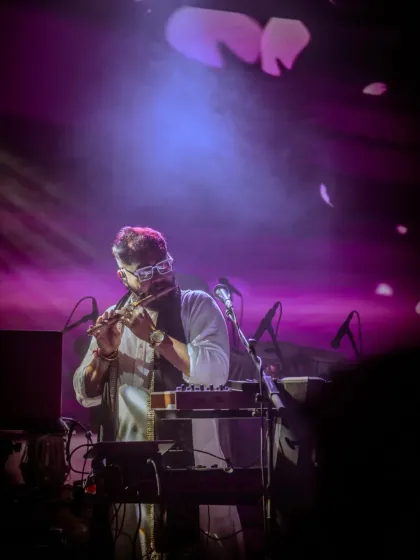 The flute's melody floating over the audience at Taj Vivanta, creating a moment of pure 'sukoon'.