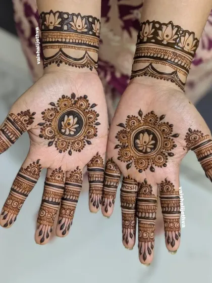 A simple and elegant mandala design. The lotus at the center is surrounded by delicate dots and lines, perfect for a minimalist look.