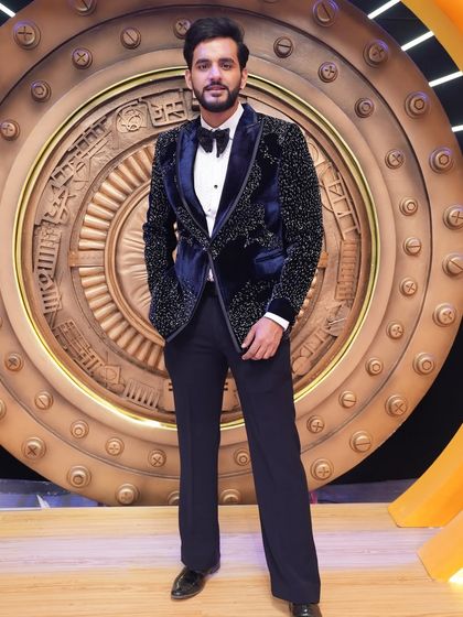 We were thrilled to design this navy blue velvet tuxedo for YouTuber Abhishek Malhan. The jacket is covered in subtle glitter, making it perfect for the spotlight of his show.