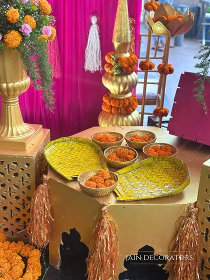 Golden platters and bowls filled with marigold petals are ready for the ceremony. These elements are not just for decoration; they are an integral part of the ritual, and I ensure they are presented beautifully.