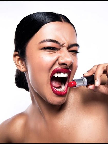 This image brings a fierce, edgy attitude to the lipstick campaign. The pose is unconventional and bold, designed to stop the scroll and make a statement. It shows that a beauty product can be part of a powerful, expressive look.
