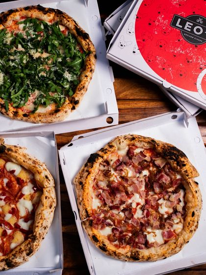 Our pizzas look just as good in their takeout boxes. Here's a delivery order with a variety of our best pies.