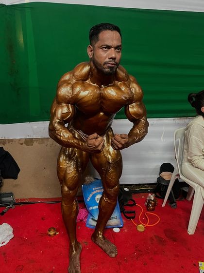 A most muscular pose backstage. This pose is all about showing maximum muscle density and hardness.