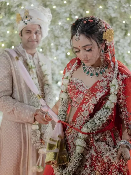 Anaaya and Nikunj during their pheras. This moment captures the solemnity and beauty of the Hindu wedding ritual, as they take their seven steps and vows together.