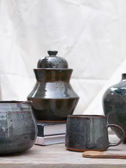 This collection showcases the depth and character of our Pirate Black glaze. It's a stunning glossy black that breaks into subtle hues of purple, blue, and brown, adding complexity and elegance to any piece.