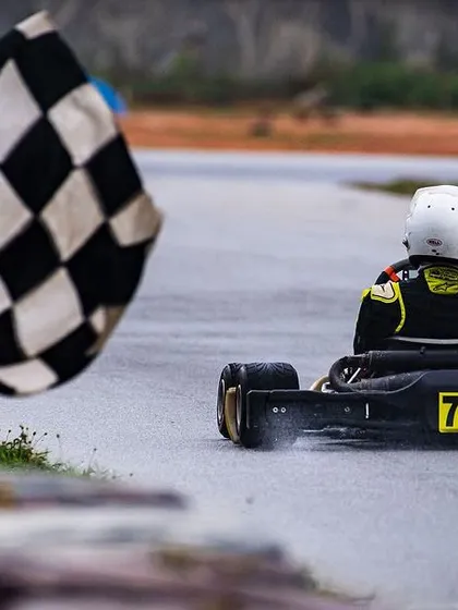 The moment every driver dreams of: crossing the finish line to the checkered flag. This shot from the Meco Meritus Cup captures the culmination of a weekend of intense racing, strategy, and pure determination.