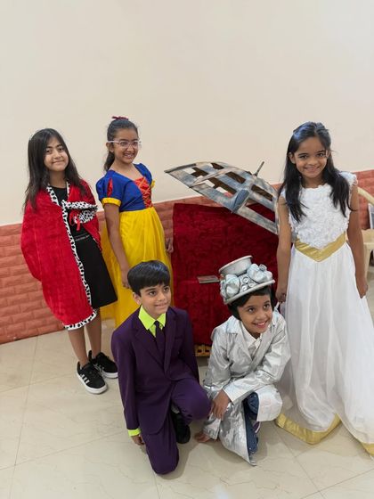 A fantastic lineup of characters, including Snow White and the Joker. The students' detailed costumes and proud smiles show their excitement and readiness for their Trinity Group Drama exam.