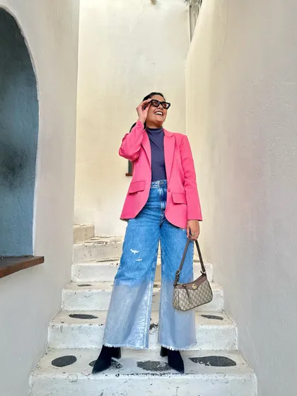 A happy, candid moment. For me, fashion is about feeling good and expressing yourself, whether it's through a statement blazer or a unique accessory.