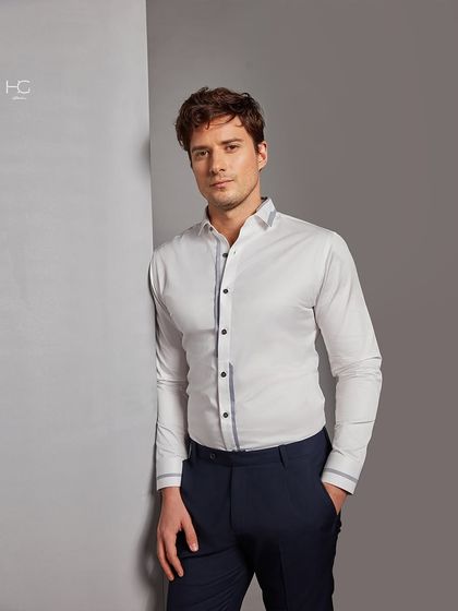 You can make a statement with the perfect white shirt. This one features subtle grey piping along the placket and cuffs, adding a touch of modern detail to a timeless classic.