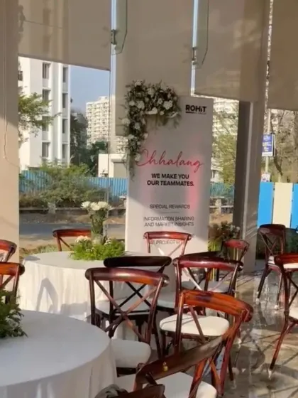 A closer look at the event branding, with custom banners and floral accents that seamlessly integrate the company's identity into the decor.