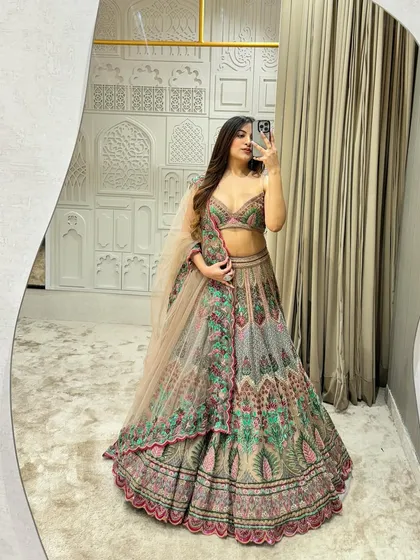 A closer look at the mirror selfie showing the beautiful drape and fit of the Unicorn Lehenga. The detailed embroidery and flattering silhouette make it a perfect choice for your engagement or wedding day.