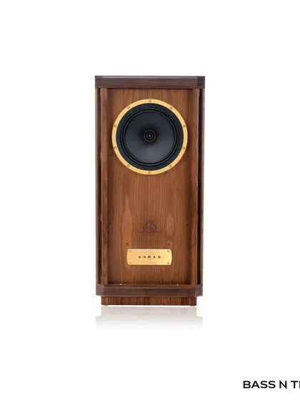 A frontal view of the Tannoy Stirling Gold Reference, showcasing its iconic 10-inch Dual Concentric driver and handcrafted oiled walnut cabinet.