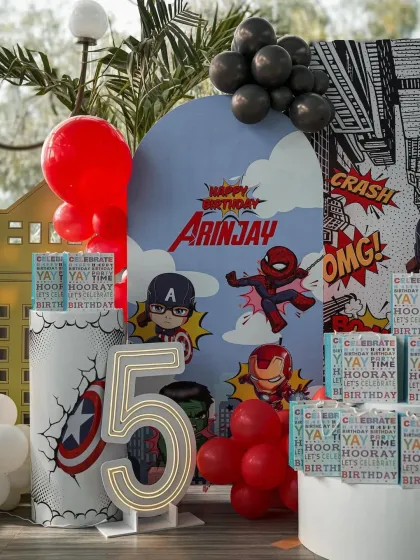 It's time to assemble the heroes! Our superhero parties are action-packed, like this Avengers-themed setup for a 5th birthday. We design custom backdrops with your child's name and their favorite characters for a truly super day.