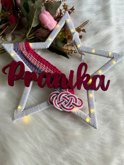 A beautiful shot of the 'Pranika' star hanging with its lights on, perfect for a magical bedroom theme.