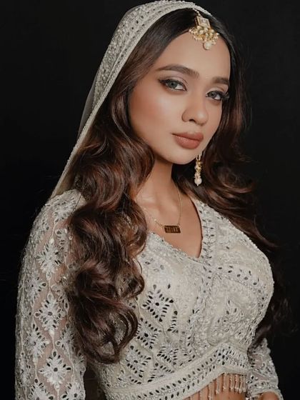 Bridal jewelry, like this beautiful maang tikka and earring set, is also available for rent to complete your look.