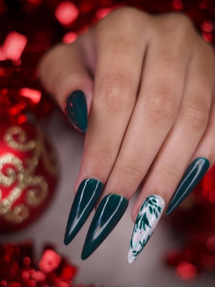 The complete green festive set posed against a background of red holiday ornaments. This highlights how the deep green color provides a beautiful and unconventional Christmas look.