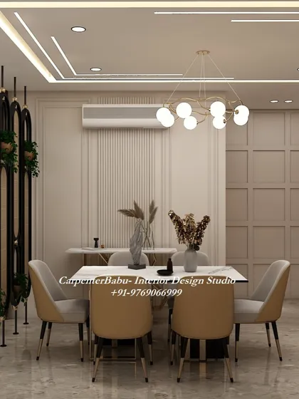 A dining area with beige chairs and a simple, elegant table. The wall paneling and vertical partition add structure and definition to the space.