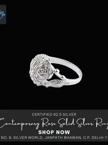 A single rose ring, delicately carved from solid silver with leaf details on the band. A simple, elegant, and romantic design.