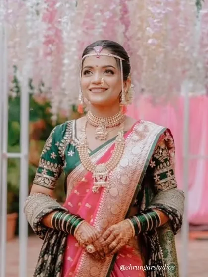 Nothing makes me happier than seeing my brides shine. Here is a beautiful bride looking radiant on her wedding day in a complete Maharashtrian jewellery set from our collection. She is wearing a traditional choker, a layered haar, and matching nath and mundavlya to complete her look.