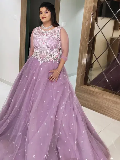 A final shot of the client in her stunning lavender gown, ready for her reception party.