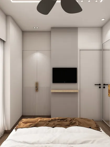 The integrated TV and storage unit in this bedroom is designed to be sleek and unobtrusive, maintaining the room's clean and modern aesthetic.
