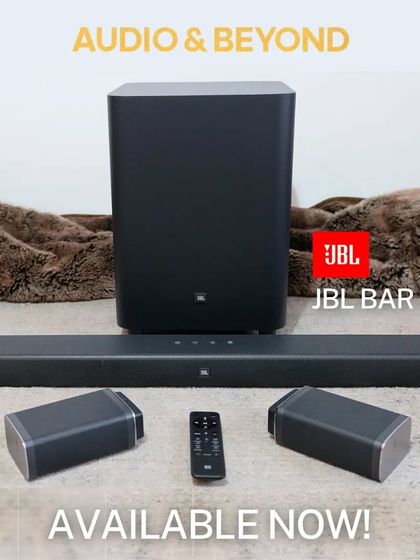 The complete JBL Bar 5.1 system, available now. This setup includes the main soundbar, two detachable wireless surround speakers, a powerful wireless subwoofer, and a remote control for a comprehensive home audio solution.