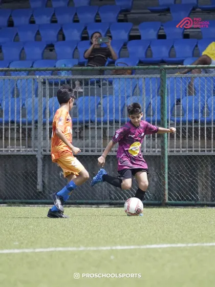 A player shoots the ball while a defender tries to block, capturing a key match moment.