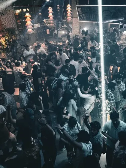 A bird's-eye view of the packed dancefloor at Boho, with a single beam of light cutting through the haze.