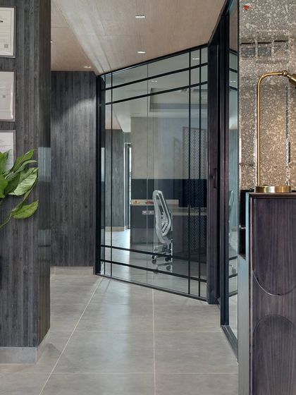 Step into the future of work with this electrifying office design. I used dark wood paneling, glass partitions, and modern furniture to create a space that is sophisticated, dynamic, and inspiring.