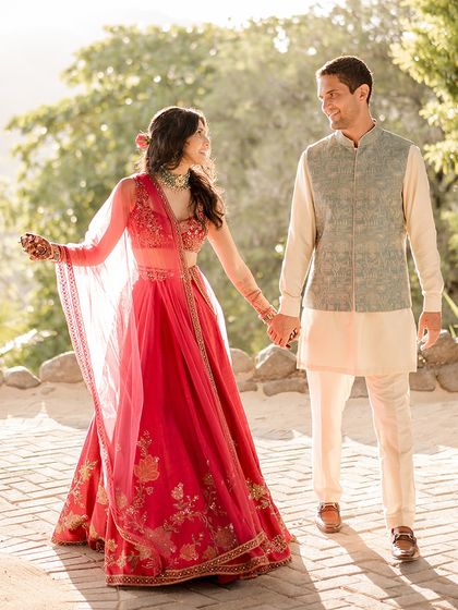 A sun-kissed moment during their Sangeet in Costa Rica. The light catches the details of their beautifully styled, coordinated outfits.