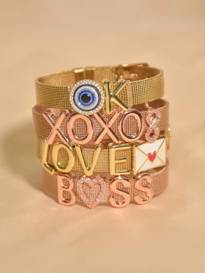 Say it all without saying a word. This stack of personalized mesh bracelets shows off some of my favourite words to wear: 'BOSS', 'LOVE', 'XOXO'. What will yours say?