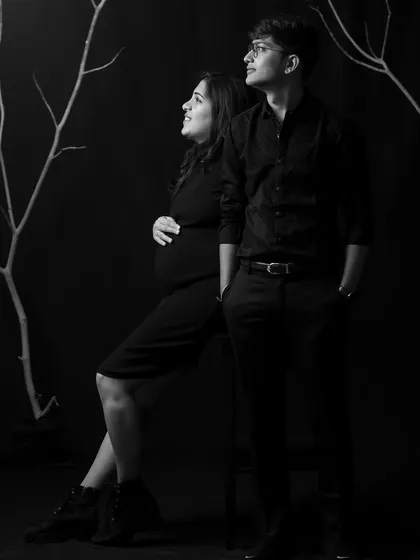 There is a special kind of magic in monochrome. This classic black and white maternity portrait focuses on emotion and connection, using dramatic lighting to create an elegant and artistic image of a couple awaiting their new arrival.