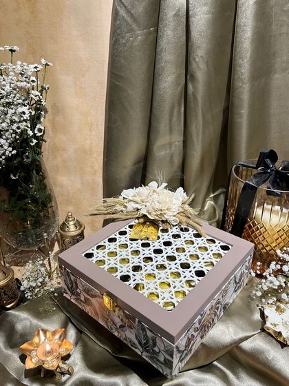 A beautiful floral and rattan box from our Diwali collection, filled with premium dry fruits. This is a great example of our eco-chic gifting style.