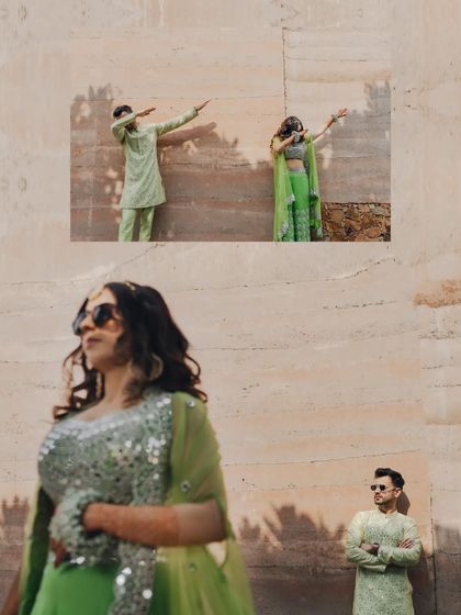 A fun, stylized shot of the couple dabbing, showing their modern and playful personalities during the Mehendi.