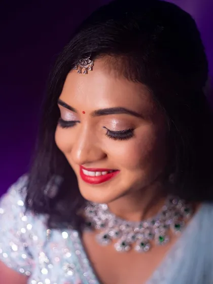 Another beautiful close-up, showing the soft smile and glowing skin that completed her reception look.